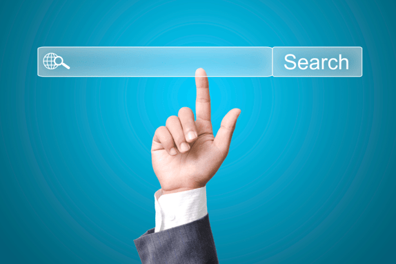 a finger pointing at a search bar to find a b2b seo agency